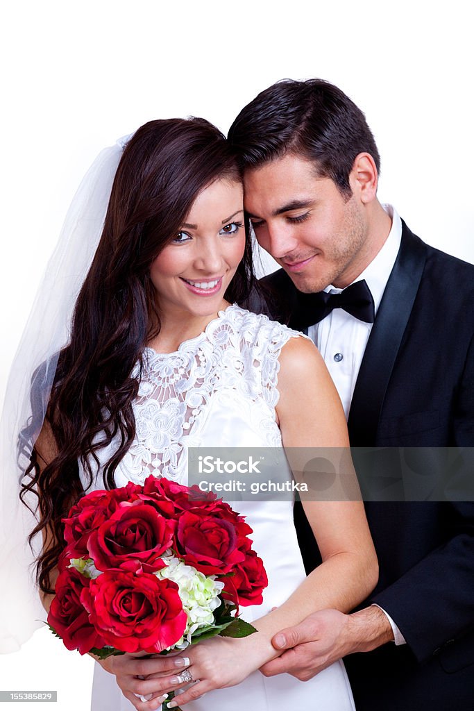 A bride and groom with a red bouquet of flowers XXXL.  Bride and groom on a white background.  20-29 Years Stock Photo