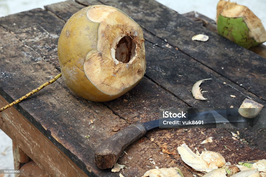 Table with coconut and a knife for cutting Asia Stock Photo