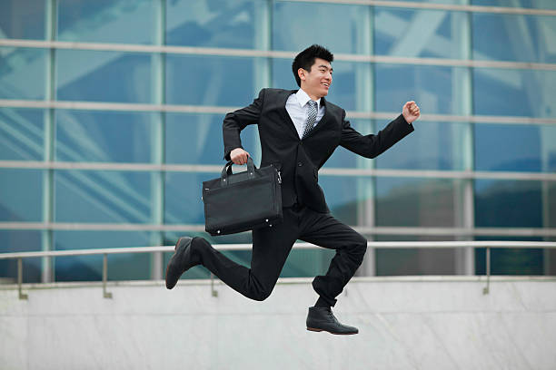 istock Businessman jumping and running in excitement 155385903