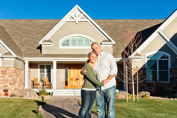 istock Young Couple Standing in front of New Home 155385928