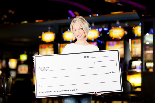 Winner: Happy young woman with blank check in a casino. You might also be interested in these: