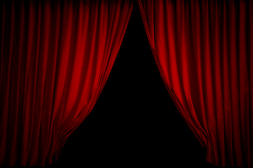 3D Closed vibrant red satin curtain drapes on maroon red stage floor with spotlight from top ceiling for luxury performance, show, concert, theater, exhibition event background
