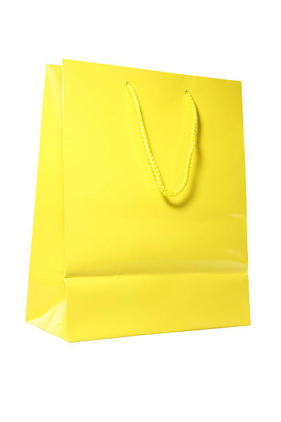 istock yellow shopping bag isolated on white 155386334
