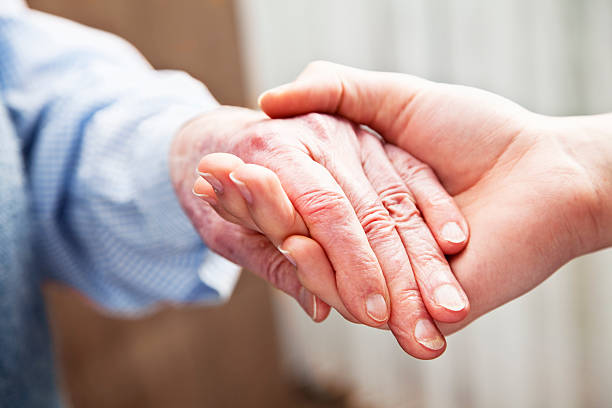 istock old and young hands togetherness care 155387307