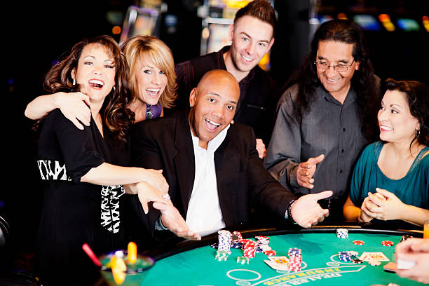 istock Excited winner with friends at the blackjack table 155387767