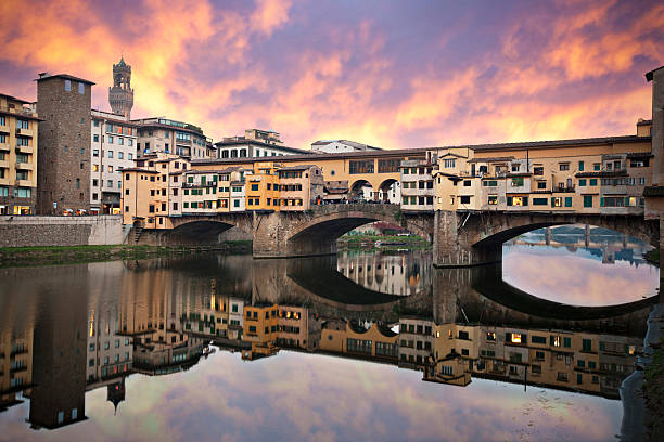 Sunset in Ponte Vecchio Dramatic sunset in Ponte Vecchio  - Florence - Tuscany - Italy - Added some grain. florence italy stock pictures, royalty-free photos & images