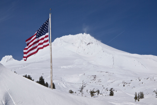 Summit of Mt Hood ( South Side ) located in Northwest Oregon. Taken on a sunny Spring like day. This photo is located near Timberline Lodge, a National Historic Landmark and has the top of a ski lift visible.