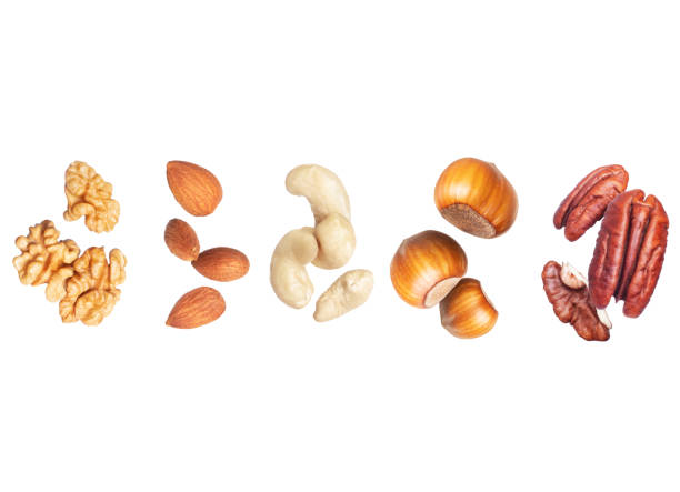 istock Set of various nuts close-up isolated on white background 1553887710
