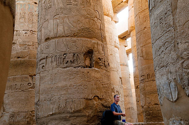 istock Tourist in Karnak Temple's Great Hypostyle Hall in Luxor, Egypt 155388781
