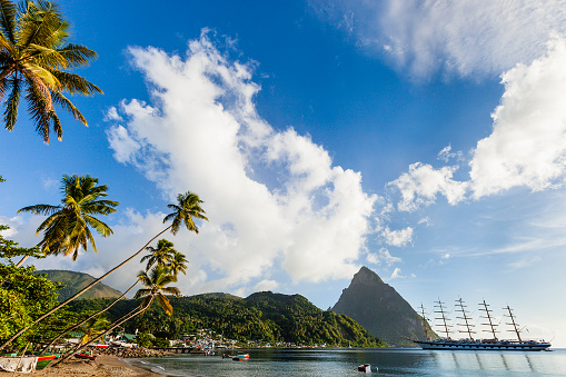 Magnificent sailing ship moored in the Soufrière Bay, on the southwest coast of Saint Lucia. Founded by the French in 1746, Soufrière was the first town of the island. In the background stands the imposing bulk of the Petit Piton, 743 meters high, one of the two twin volcanic plugs that are the natural landmark of the island. Canon EOS 5D Mark II