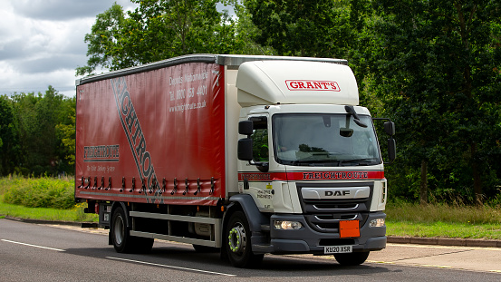 Milton Keynes,UK - July 19th 2023:  2020 DAF Trucks 2 axle rigid body lorry for Grants travelling on an English road