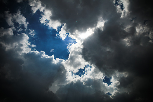Natural cloud sky background, dramatic cloud against sunlight on blue sky