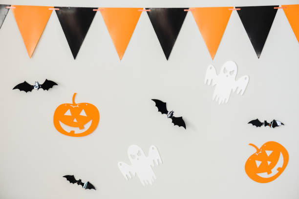 Bright Halloween background with light gray wall decorated for holiday