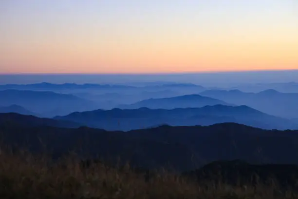 Photo of Beautiful Landscape of mountain layer at Doi Mon Jong mountain, the twilight layer of the mountain during sunrise