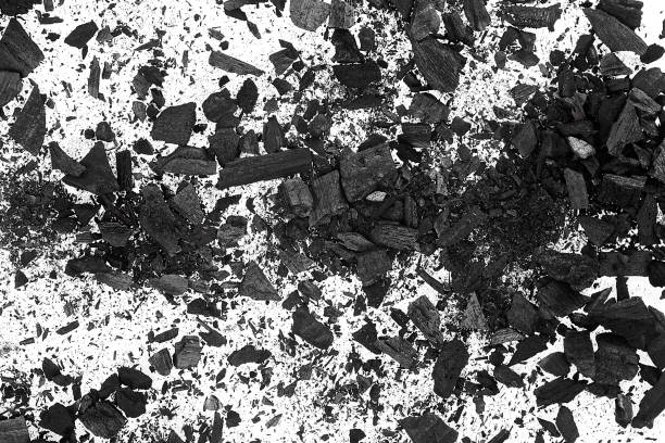 istock Pile of charcoal particles as background, top view. Xylanthrax. Wood coal. 1553903535
