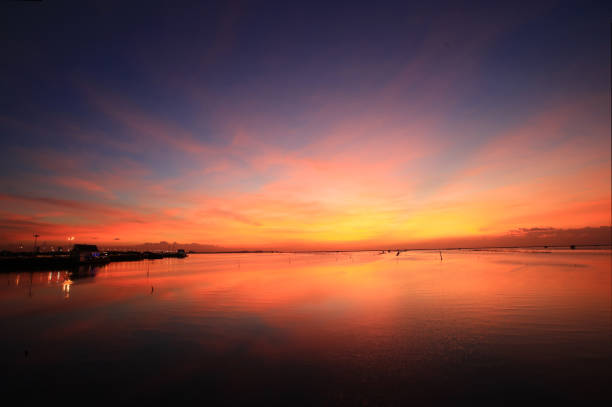 Dramatic or magic sunset sky over beach bridge at Chonburi, Thailand