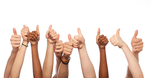 Thumbs Up Hands Raised Thumbs Up Hands Raised in Studio sea of hands stock pictures, royalty-free photos & images