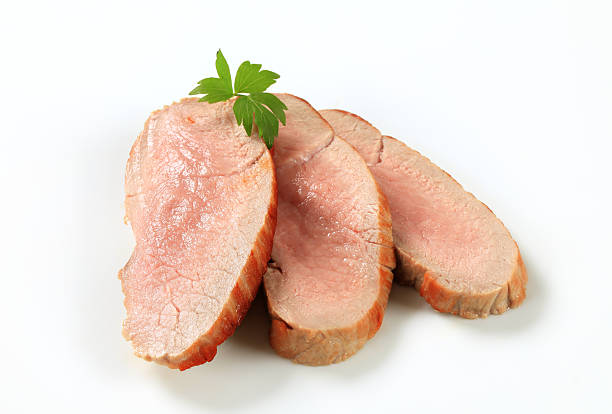Slices of roasted pork isolated on white