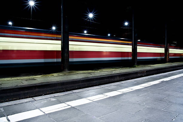istock Departing train, railroad station platform 155391489