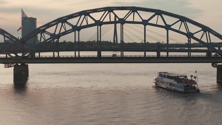 Small cruise ship or a speed boat cruising down the Daugava river in Riga