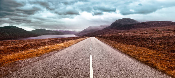 Route 832  along Little Loch Broom, to the left, in Scotland's highlands on a rainy day.