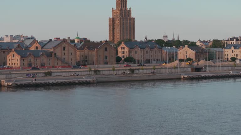 Small cruise ship or a speed boat cruising down the Daugava river in Riga