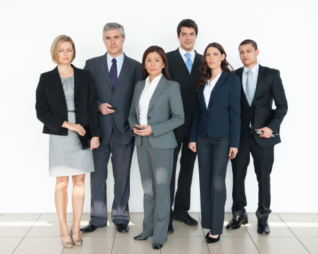 Full length portrait of confident multi ethnic business people standing together. Horizontal shot.