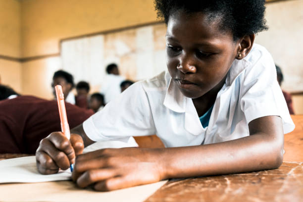 istock Little African girl writing in Classroom 155391896