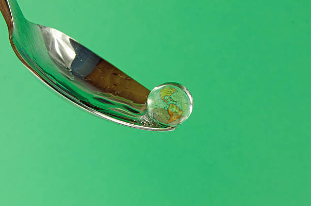 istock Spoon, Earth and a Drop of Water 155391994