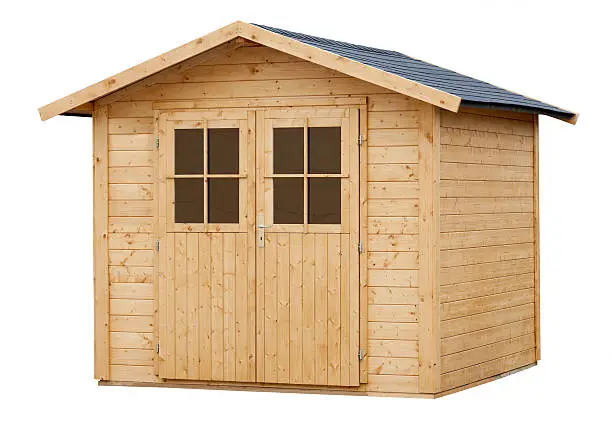 Close up of a new wooden garden shed on white background 
