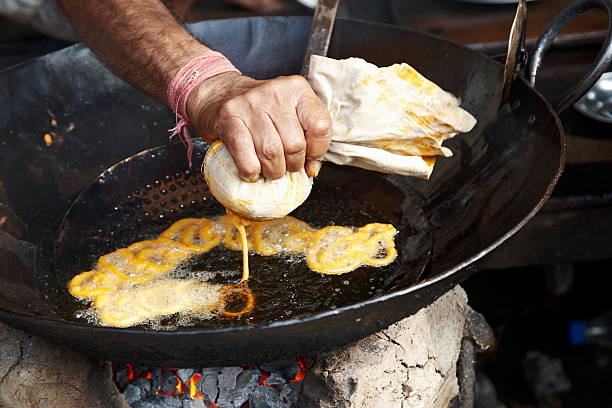 istock Indian street vendor making deep-fried snack 155392100