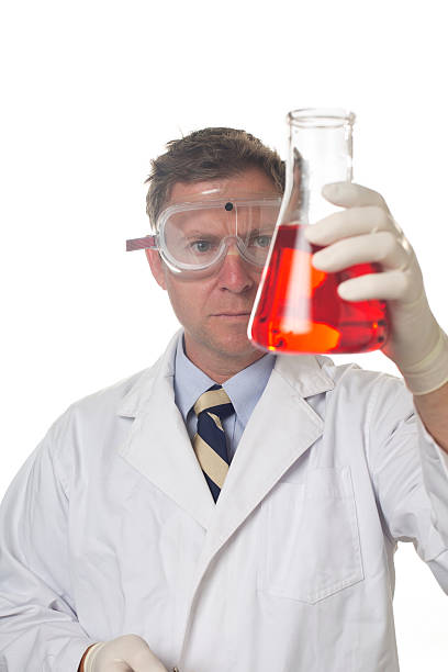 istock Scientist With a Flask of Chemicals 155392438
