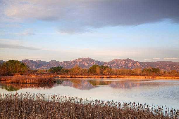 istock Flatirons at dawn reflecting in lake 155392679