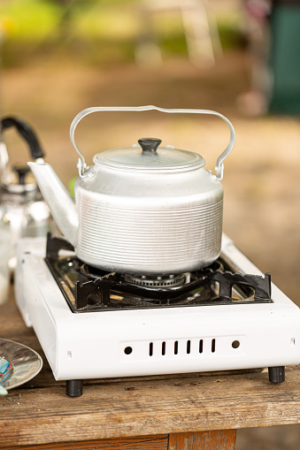 Kettle on portable gas stove camping