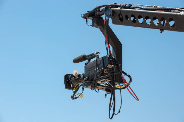 istock Jimmy Jib and the camera shooting in the open sky 1553929230