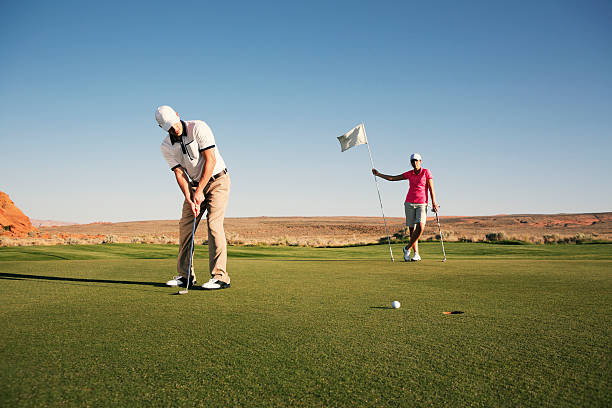 un birdie - golf putting determination focus foto e immagini stock