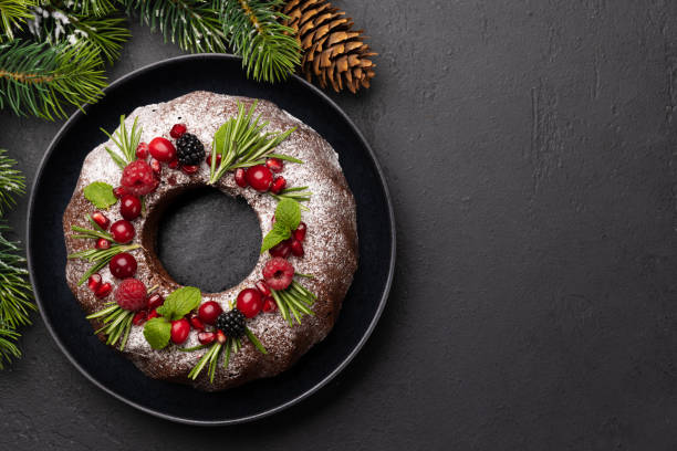 istock Christmas cake with pomegranate seeds, cranberries and rosemary 1553930559