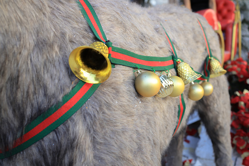 Gold ring hanging on artificial reindeer, Merry Christmas and Happy New Year concept