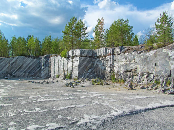 istock Summer landscape with abandoned marble quarry. 1553930687