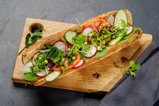 Delicious vegetarian sandwich stuffed in a fresh baguette, bursting with flavor and wholesome ingredients