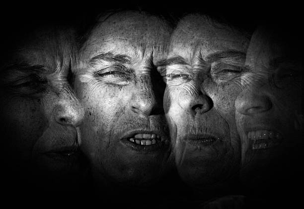 alter ego mature middle age woman.
studio shot, acting, black and white stroboscopic image schizophrenia photos stock pictures, royalty-free photos & images