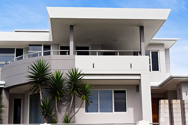 istock Front view of modern house against blue sky 155393341