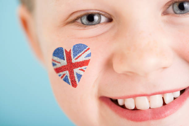 istock Union Jack on cheek of young England fan 155393576