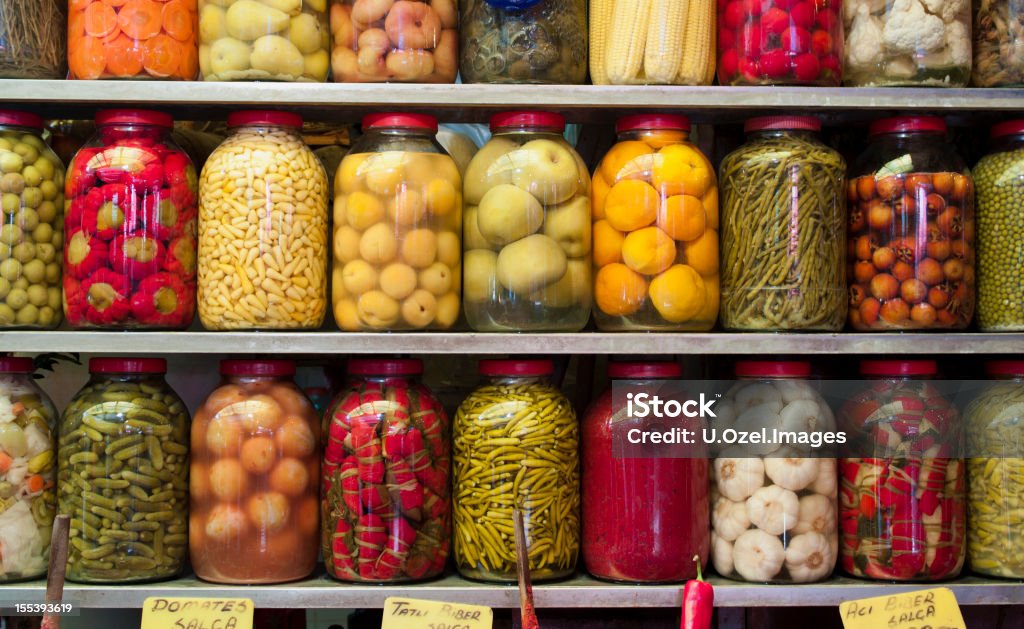 Jars of preserved vegetables on shelves  Agricultural Fair Stock Photo