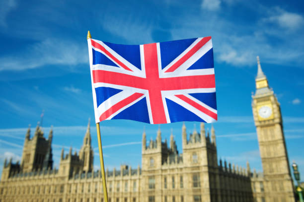 istock Union Jack Flag Waves Over Westminster Palace London 155393876