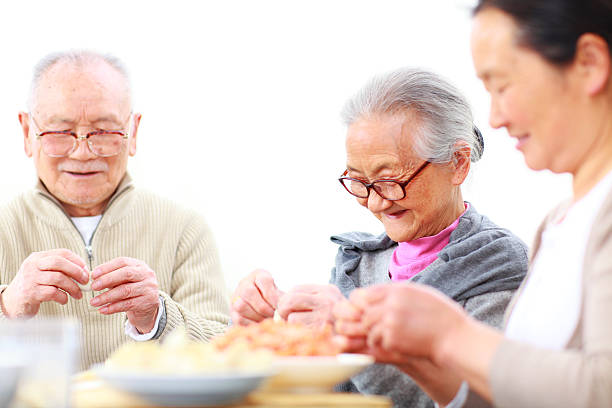 istock Chinese family making dumpling together 155394069