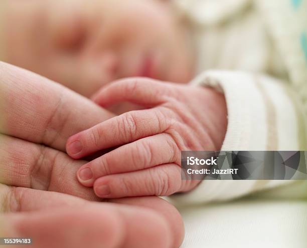 Baby Holding Adult Finger Stock Photo - Download Image Now - Newborn, Senior Adult, Adult