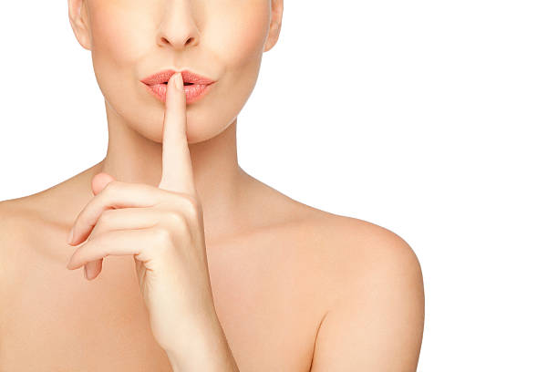 Woman Asking For Quiet or Silence On White Background stock photo