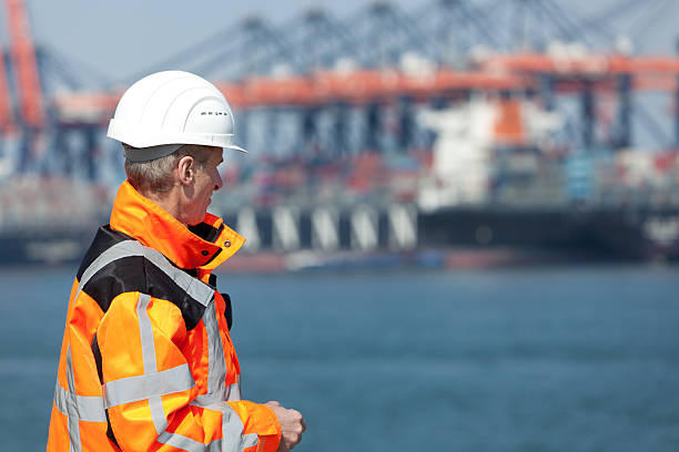 dockworker - engineer environment orange manual worker ストックフォトと画像