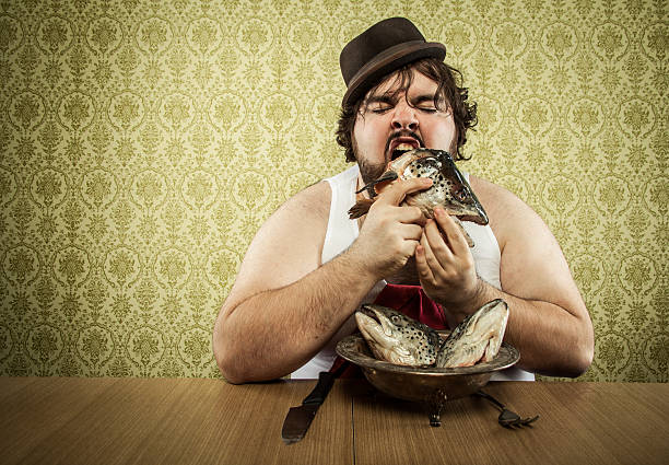istock vintage fat man eating fish head soup at wood table 155394736